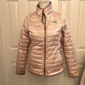 Girls Large Soft Pink The North Face reversible coat.